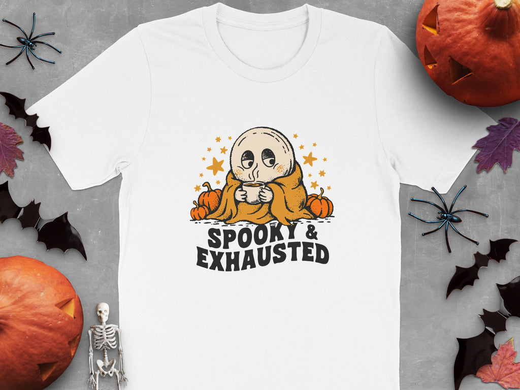 White t-shirt with cartoon ghost holding a coffee cup, "SPOOKY & EXHAUSTED" text.