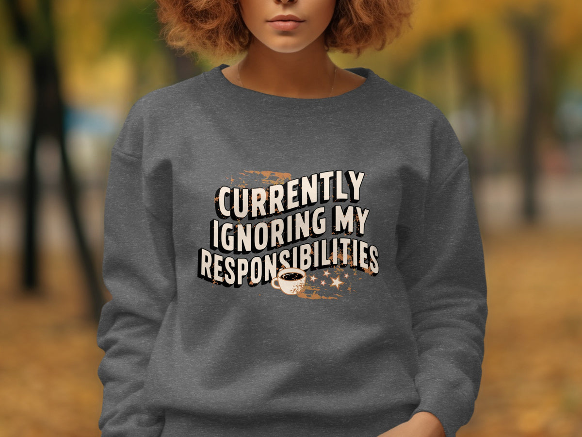 Dark gray sweatshirt with text "Currently Ignoring My Responsibilities" and coffee cup.