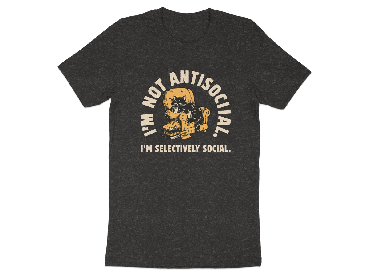 T-shirt graphic: cat on armchair with mug, "I'M NOT ANTISOCIAL. I'M SELECTIVELY SOCIAL."