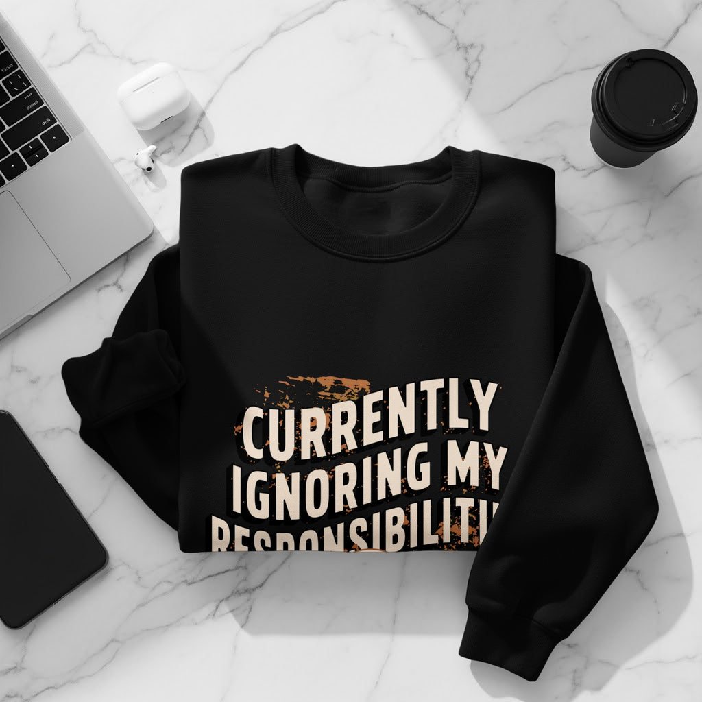 Black sweatshirt with "Currently Ignoring My Responsibilities" text and graphic elements.