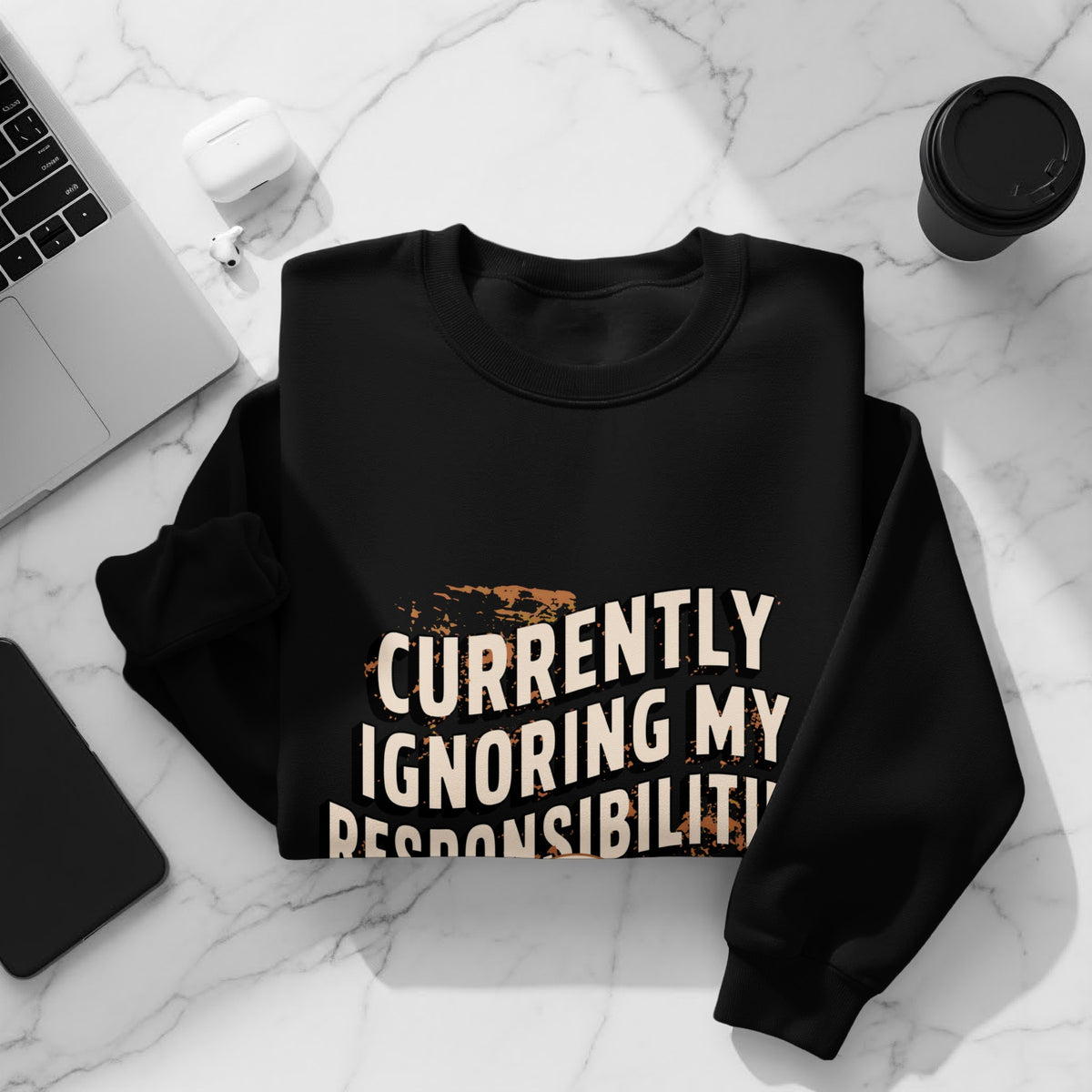 Black sweatshirt with "Currently Ignoring My Responsibilities" text and graphic elements.