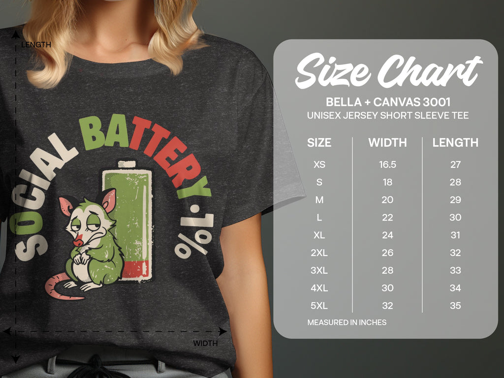 Dark grey t-shirt with "SOCIAL BATTERY 1%" graphic and size chart.