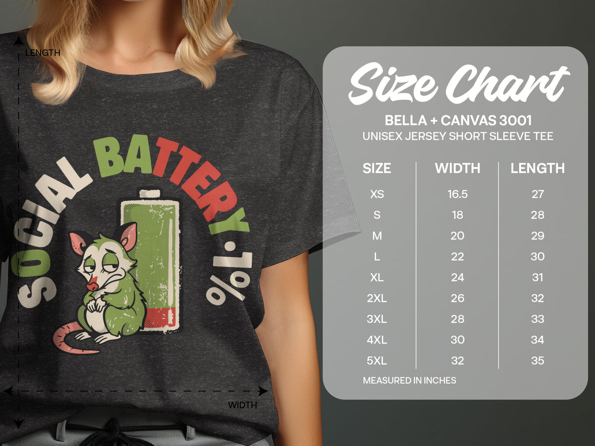 Dark grey t-shirt with "SOCIAL BATTERY 1%" graphic and size chart.