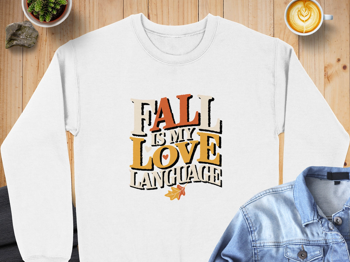 White sweatshirt with "Fall Is My Love Language" text in autumn colors.