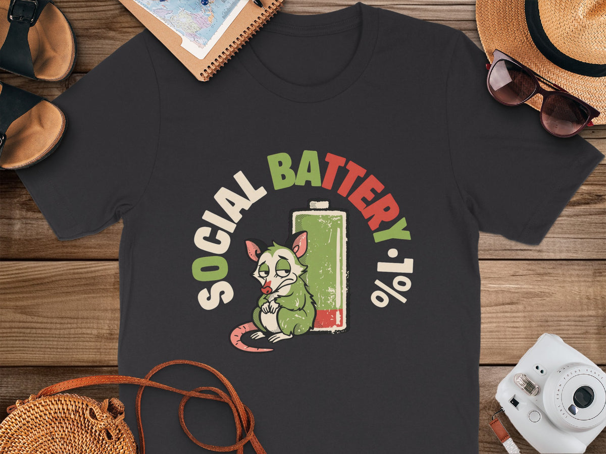T-shirt with a tired opossum and "Social Battery 1%" graphic.