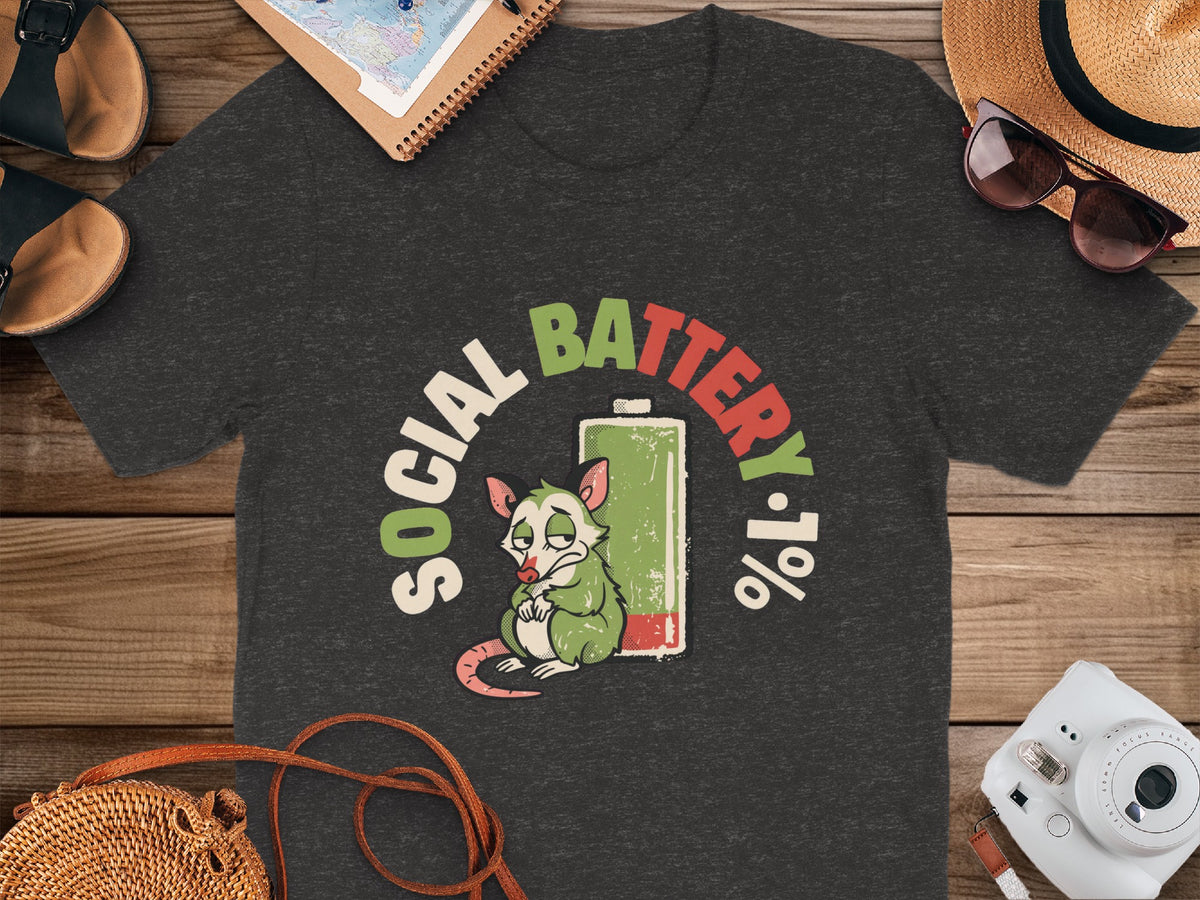 Dark grey t-shirt with graphic art of a possum and text "SOCIAL BATTERY 1%".