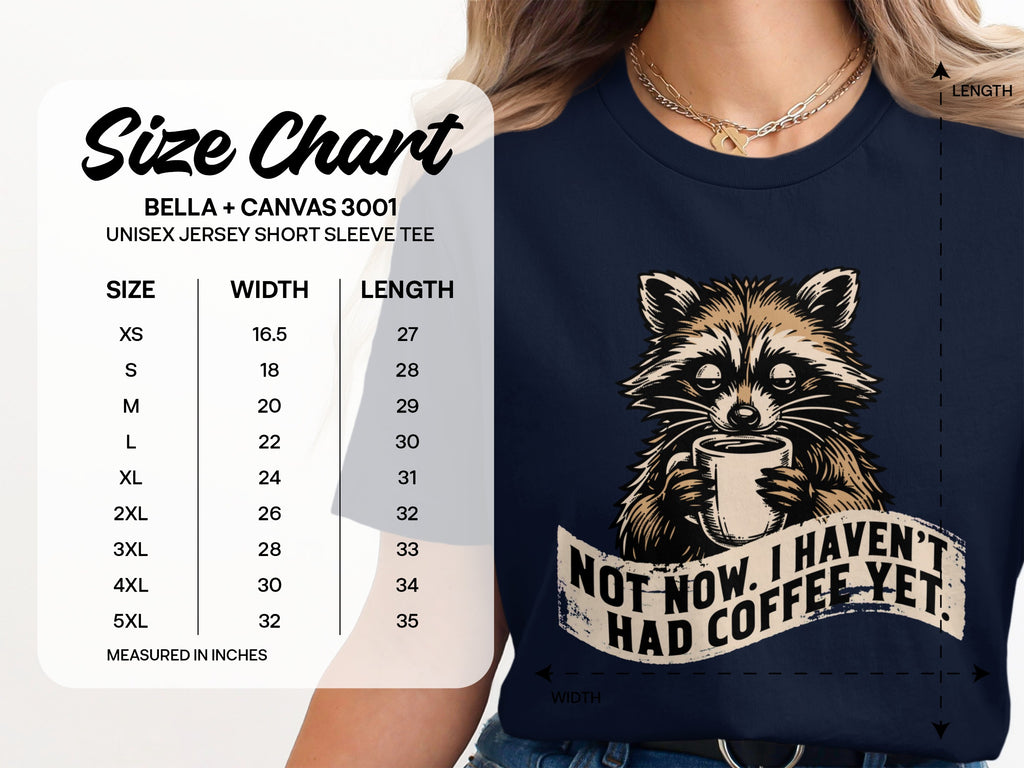 Unisex jersey tee size chart and a raccoon holding coffee that says "Not now. I haven't had coffee yet."