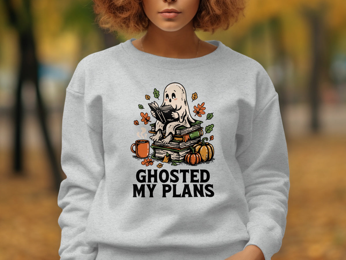 Ghost sitting on books with pumpkins and text "GHOSTED MY PLANS".