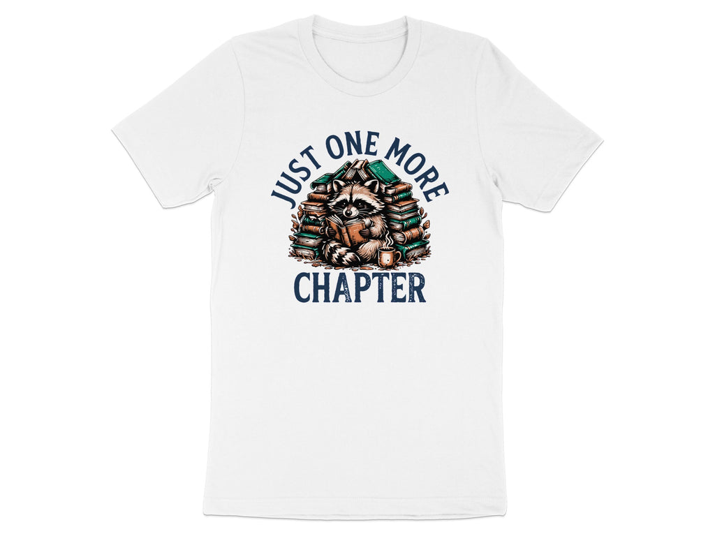 Raccoon reading book surrounded by stacked books and coffee cup, text "JUST ONE MORE CHAPTER".
