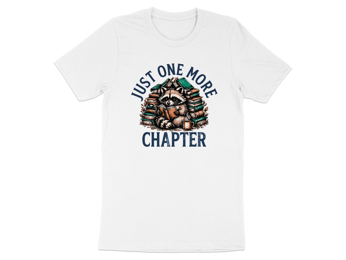 Raccoon reading book surrounded by stacked books and coffee cup, text "JUST ONE MORE CHAPTER".