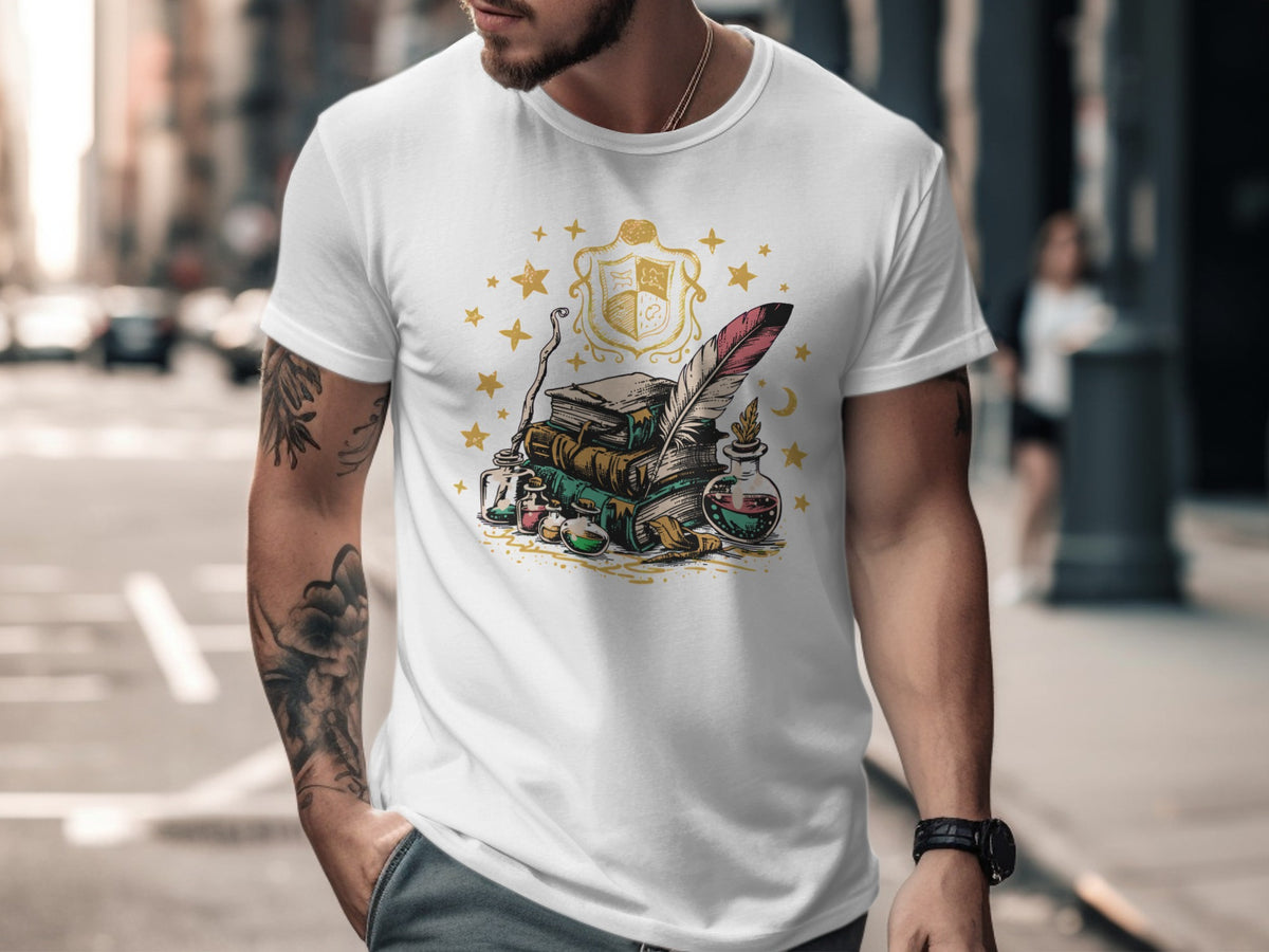 White t-shirt with an illustration of books, quill, inkwell, and potion bottles.