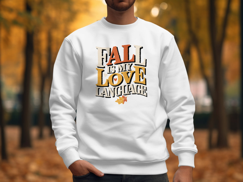 White sweatshirt with "Fall is My Love Language" text and a leaf graphic.