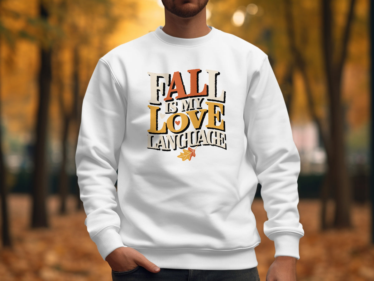 White sweatshirt with "Fall is My Love Language" text and a leaf graphic.