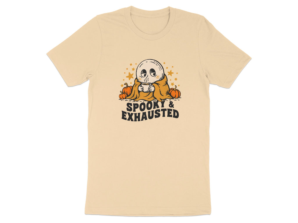 T-shirt with a ghost drinking coffee surrounded by pumpkins and stars, text reads "SPOOKY & EXHAUSTED".