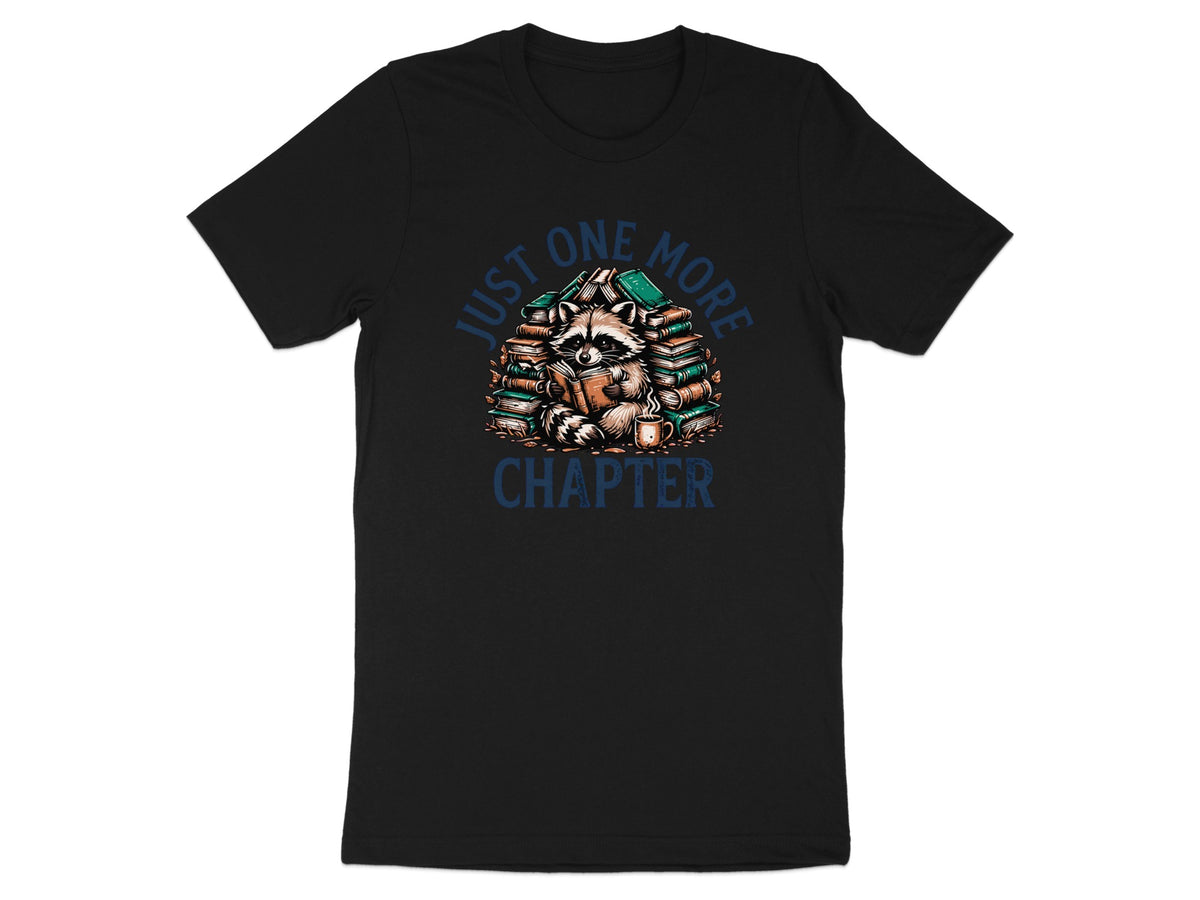 Black t-shirt with raccoon reading amongst books and text "JUST ONE MORE CHAPTER".