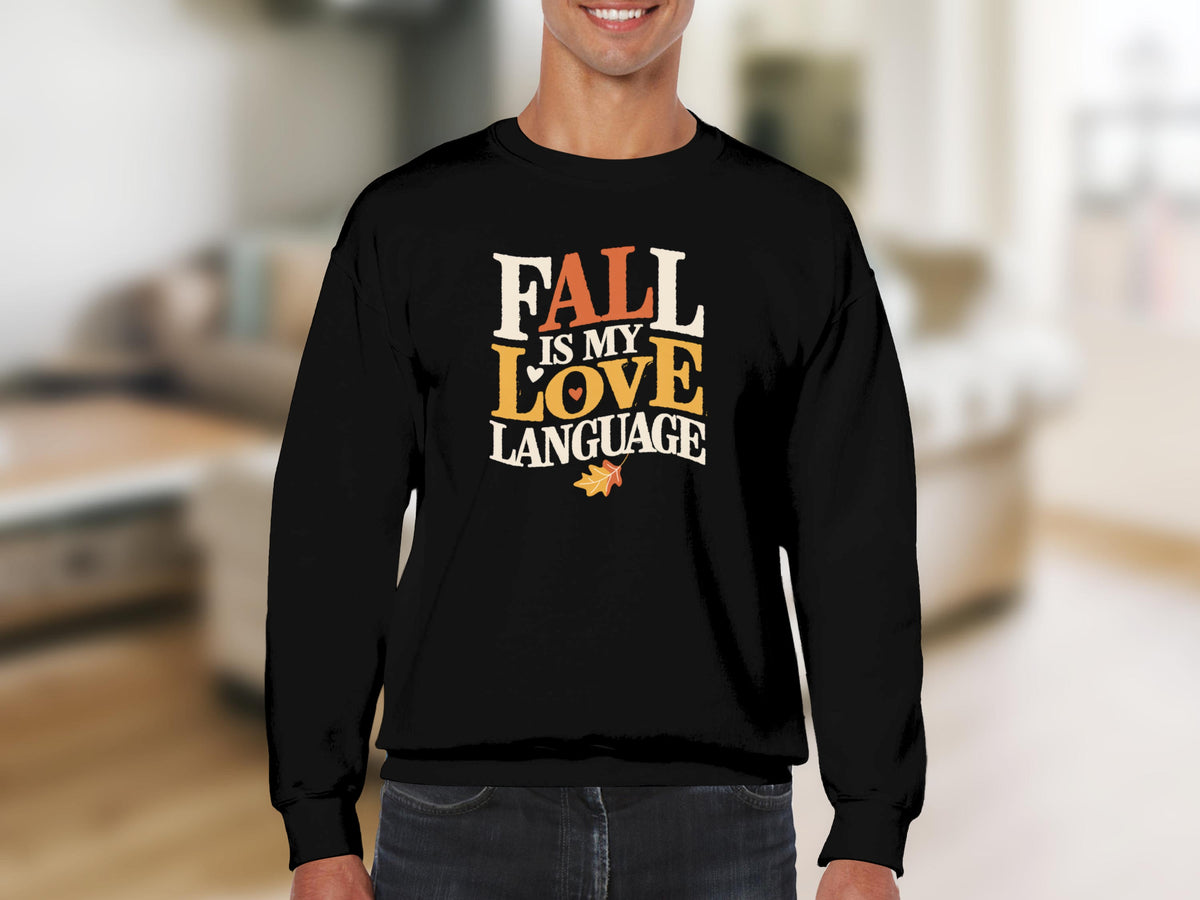 Black sweatshirt with "Fall is my love language" text and fall leaf graphic.