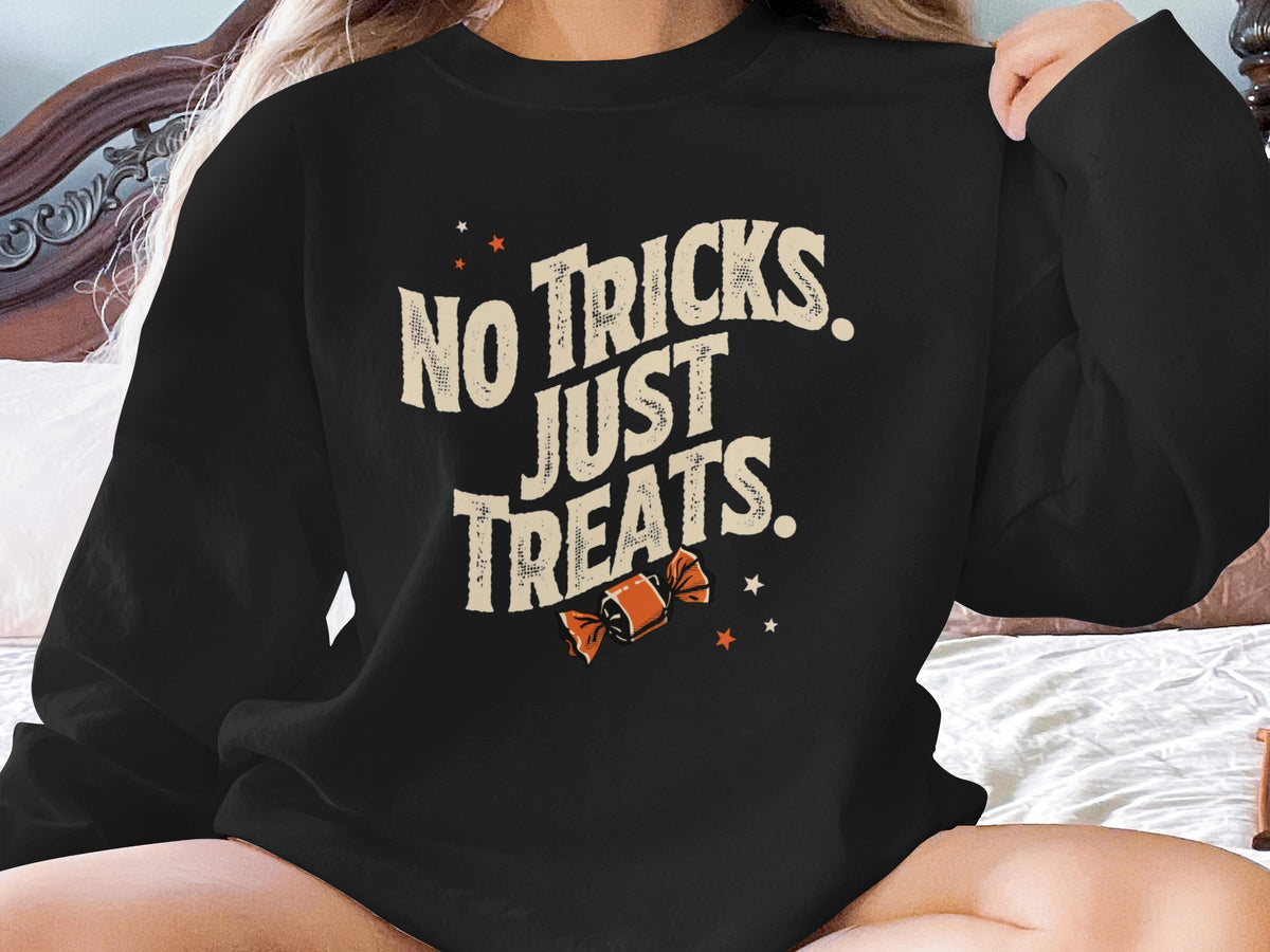 Black sweatshirt with "No Tricks. Just Treats." text and a candy graphic.