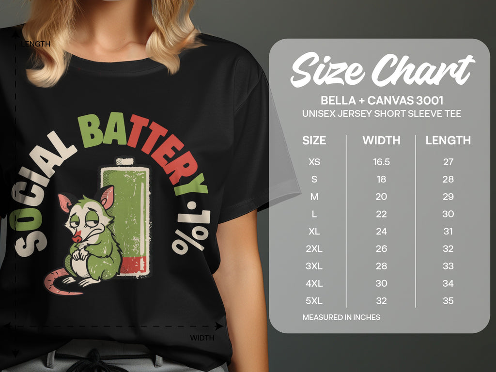 T-shirt with "Social Battery 1%" graphic and Bella + Canvas 3001 size chart.