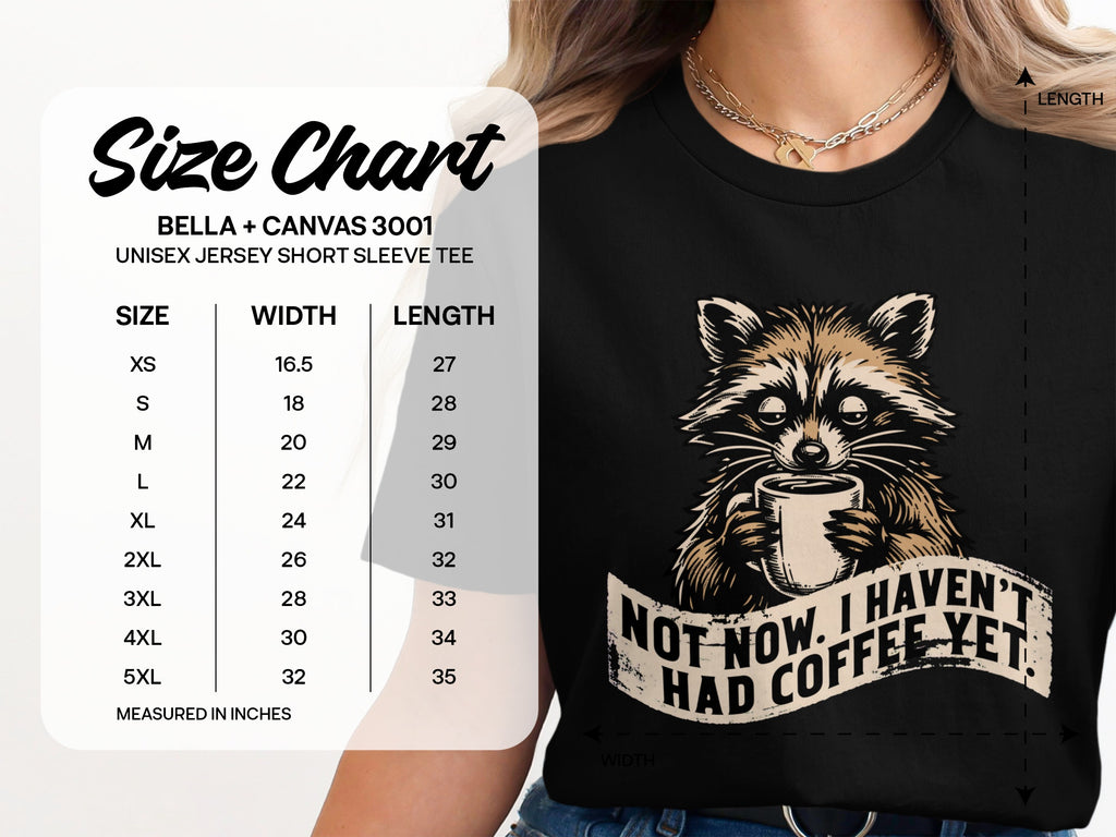 Black t-shirt with raccoon holding coffee and text "Not now. I haven't had coffee yet."