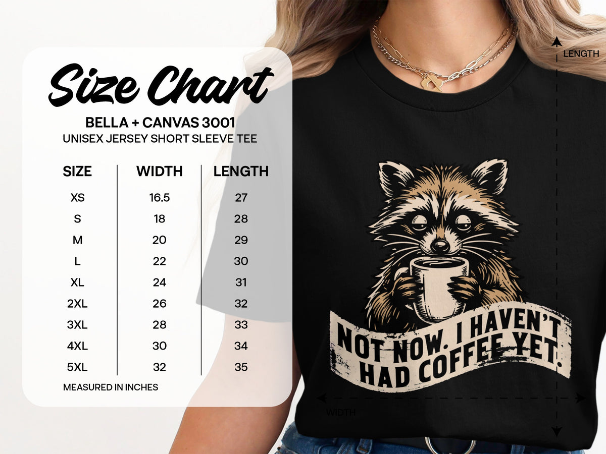 Black t-shirt with raccoon holding coffee and text "Not now. I haven't had coffee yet."