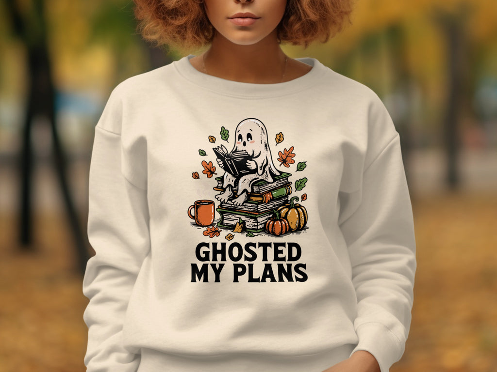 Ghost reading on books with pumpkins, mug, and leaves. Ghosted My Plans text.