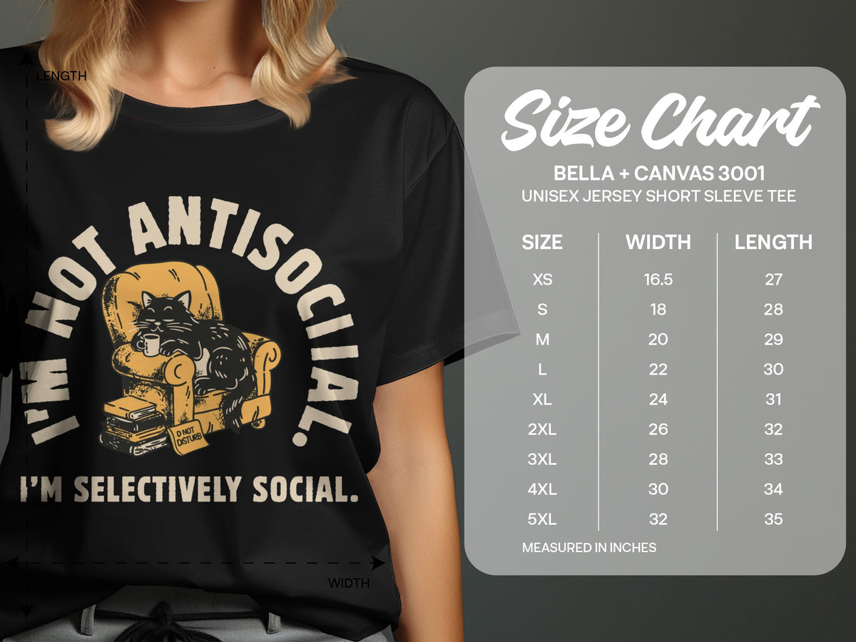 Black t-shirt with graphic of cat on chair, size chart for Bella + Canvas 3001 tee.