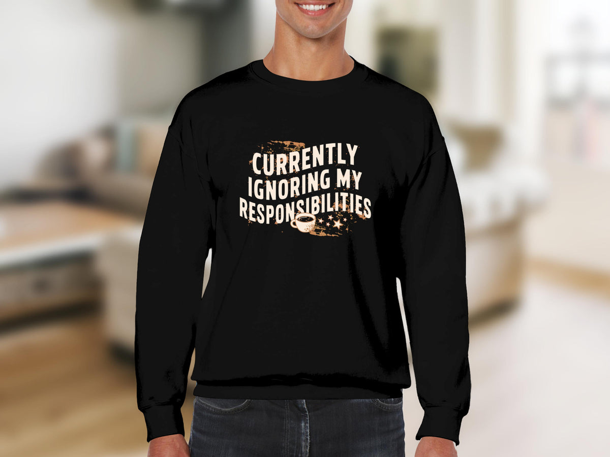 Black crewneck sweatshirt with "Currently Ignoring My Responsibilities" text and coffee cup graphic.